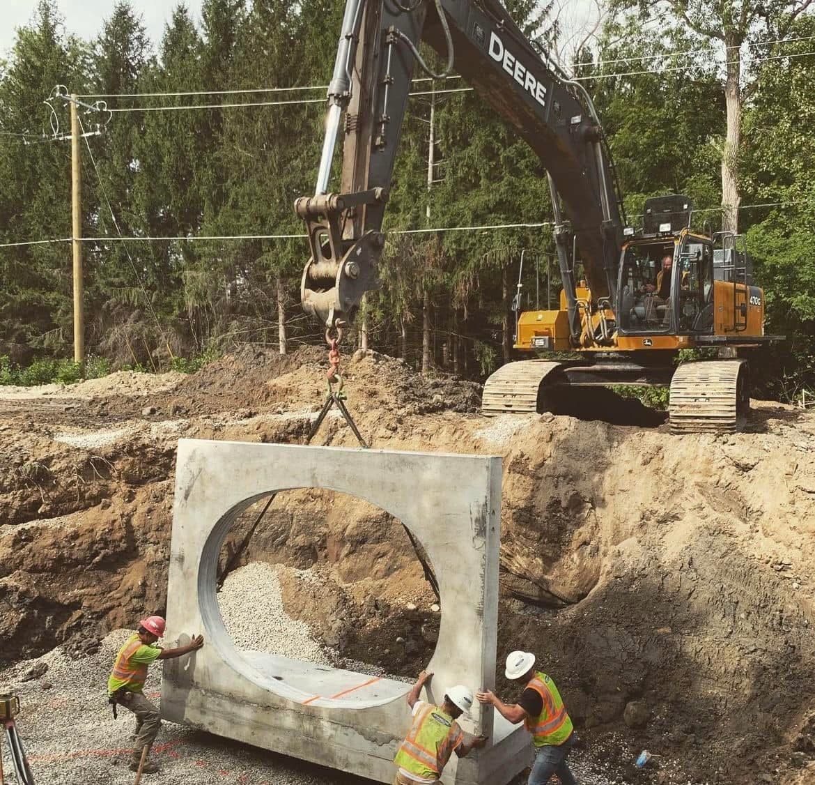 Springline Excavating crew operating equipment on a job site